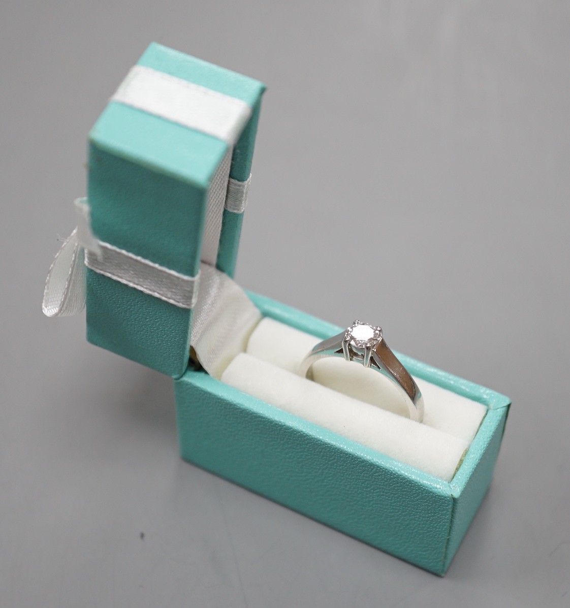 A modern platinum and solitaire diamond ring, size M, gross weight 5.2 grams